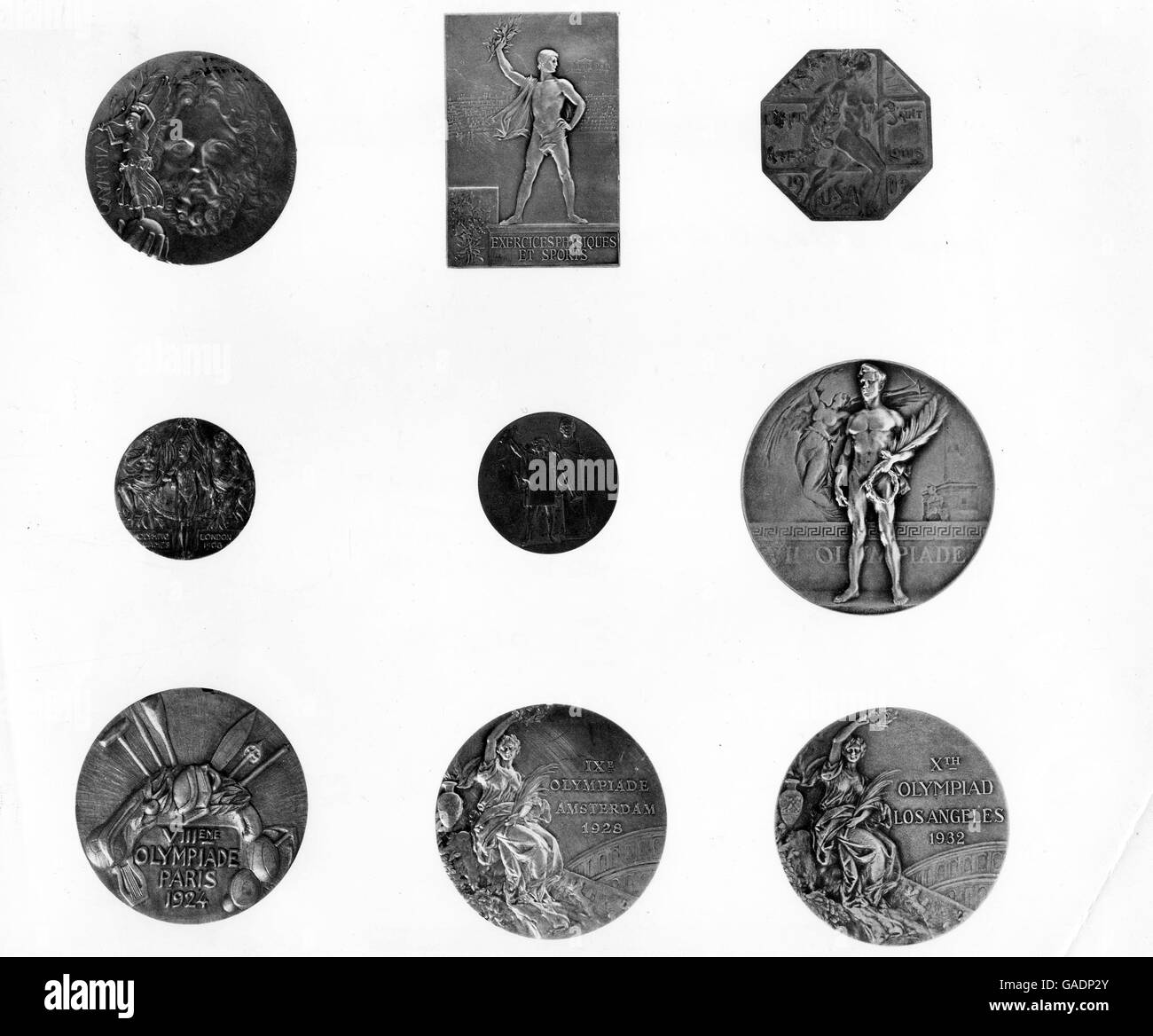 Official Olympic Medals 1896-1932: (l-r top): Greece Athens, 1896; France, Paris 1900; USA, St Louis, 1904; (l-r middle) Great Britain, London, 1908; Sweden, Stockholm, 1912; Belgium, Anvers, 1920; (l-r bottom) France, Paris, 1924; Netherlands, Amsterdam, 1928; USA, Los Angeles, 1932. Stock Photo