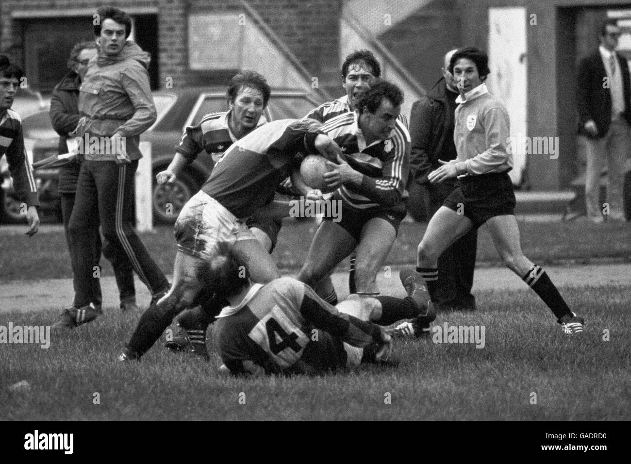 Roger Spurrell (Bath) attempts to break away from the tackle from Harlequin's M Claxton. Stock Photo