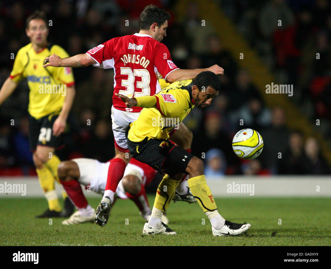 Watford's Lee Williamson (right) and Bristol City's Lee Johnson battle for the ball during the Coca-Cola Football League Championship match at Vicarage Road, Watford. Stock Photo