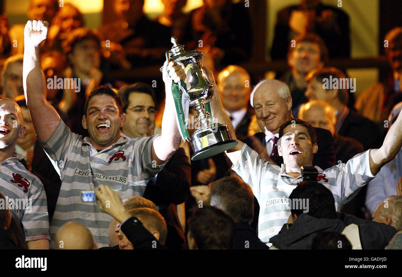 Cambridge University's John Blake (left) and captain Ross Blake lift the trophy after beating Oxford University during The 2007 Lehman Brothers Varsity Match at Twickenham, London. Stock Photo