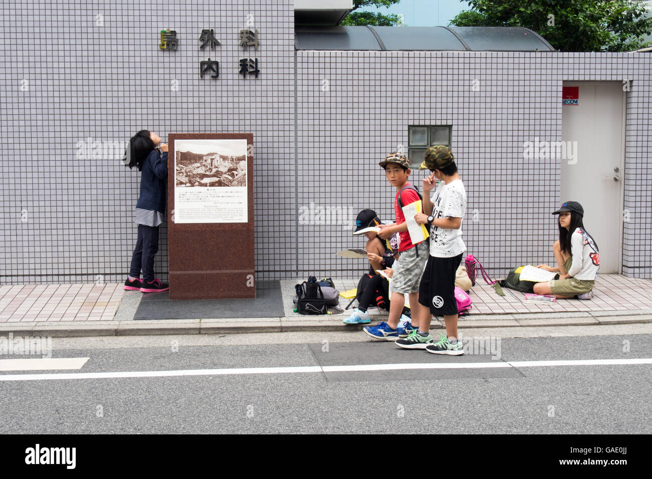 Children on a school excursion visiting the site of the hypocenter of the atomic bomb dropped on Hiroshima. Stock Photo