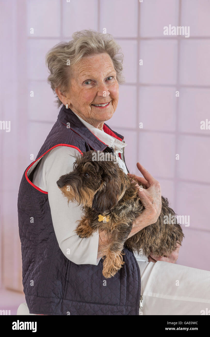 Happy elderly lady with dog hi-res stock photography and images - Alamy