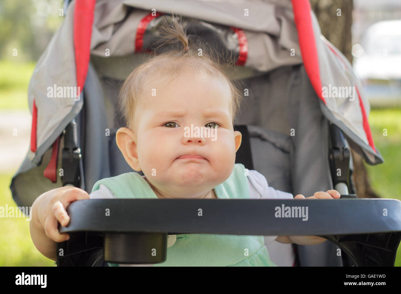 little girl sitting in a baby carriage Stock Photo - Alamy