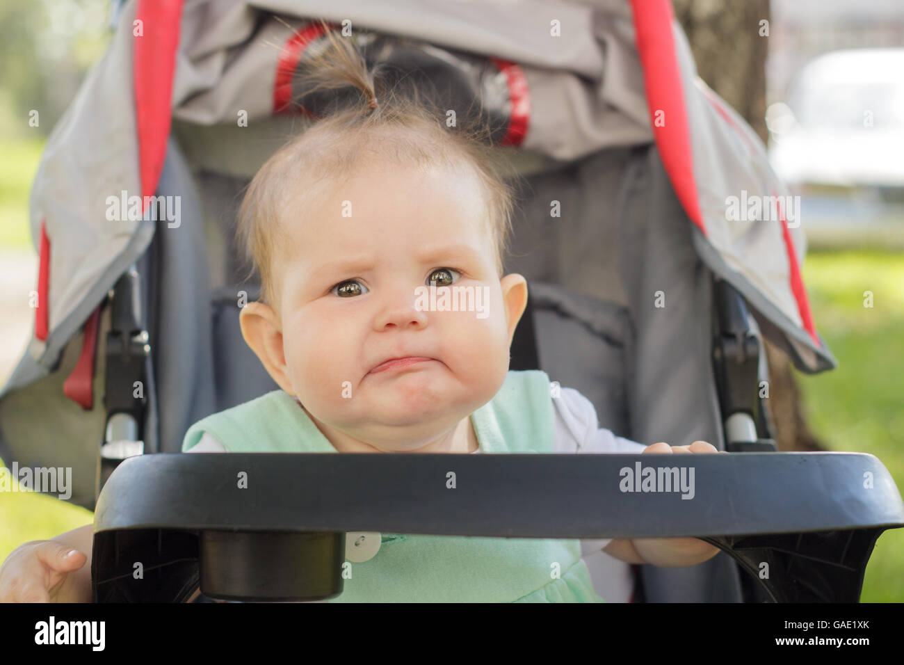 little girl sitting in a baby carriage Stock Photo - Alamy