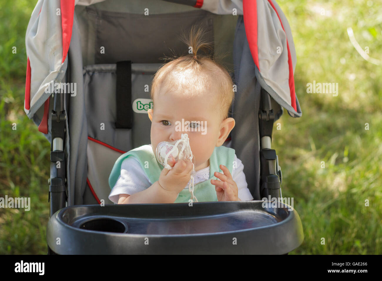 little girl sitting in a baby carriage Stock Photo - Alamy