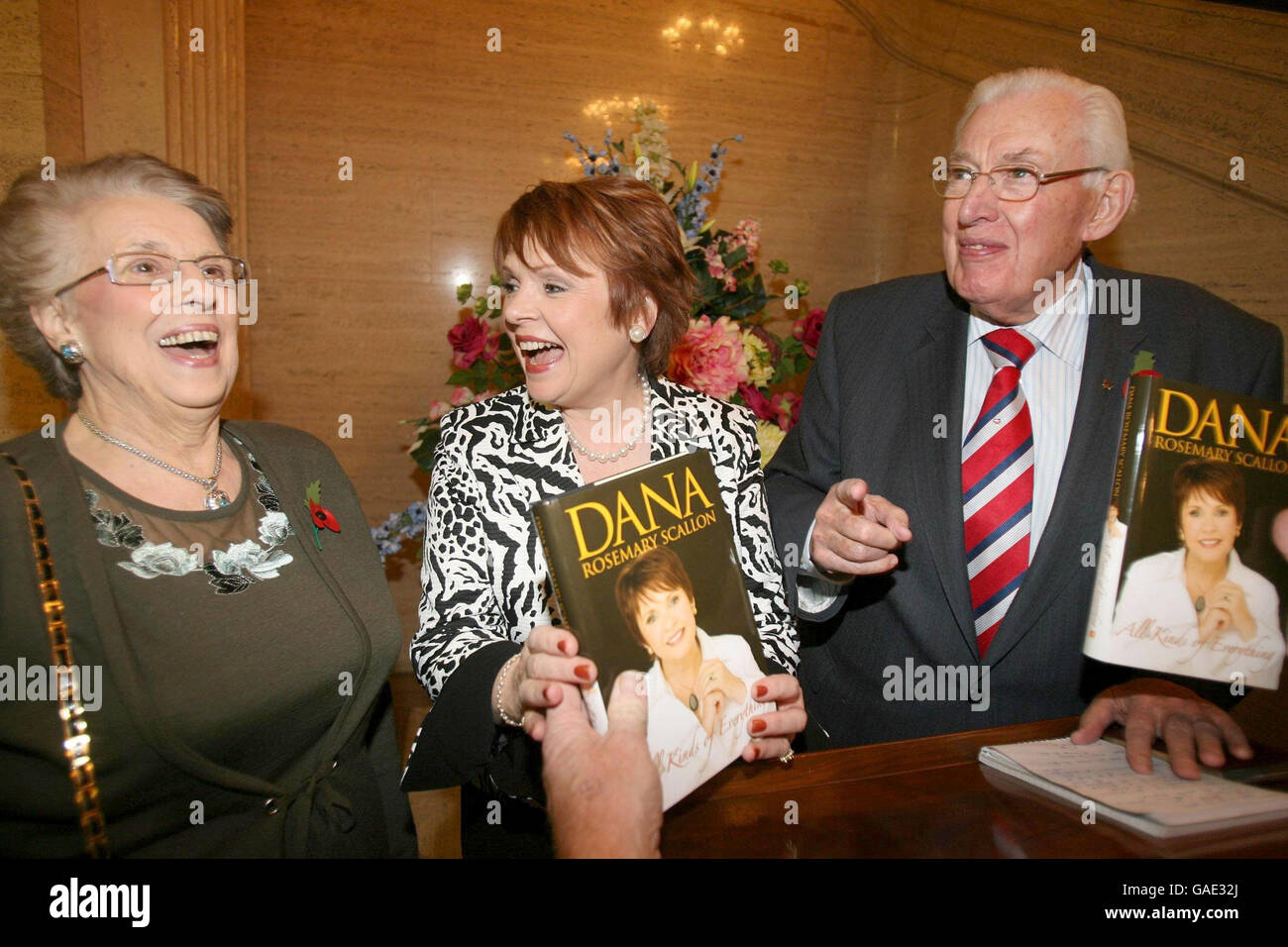 Former Eurovision song winner, Dana (centre) jokes with Northern Ireland First Minister Ian Paisley and his wife Baroness Paisley, during the Dana book launch at Parliament Buildings, Stormont. Stock Photo