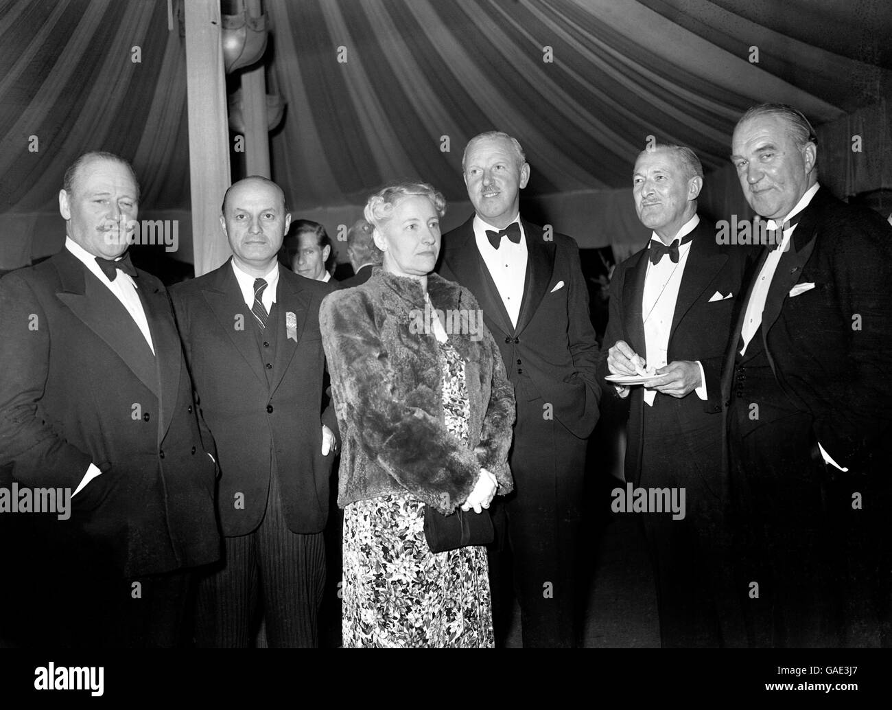 (L-R) Colonel E.A Hunter, Dr. Anderjevic (President of Yugoslav Football Association), Mrs Rous, Mr S.F. Rous (Secretary of Football Association), Mr A. Drewry (Chairman English International Committee) and Mr Von Frenkell (President Finland Football Association) attend the party Stock Photo