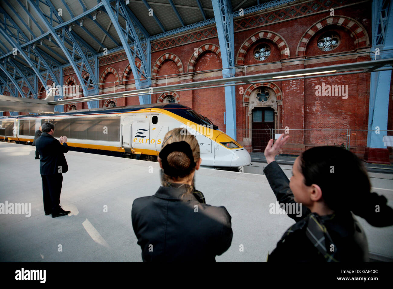Eurostar opens to public at St Pancras station. Staff wave off the Eurostar on the first high speed train to leave the new terminal at St Pancras station. Stock Photo