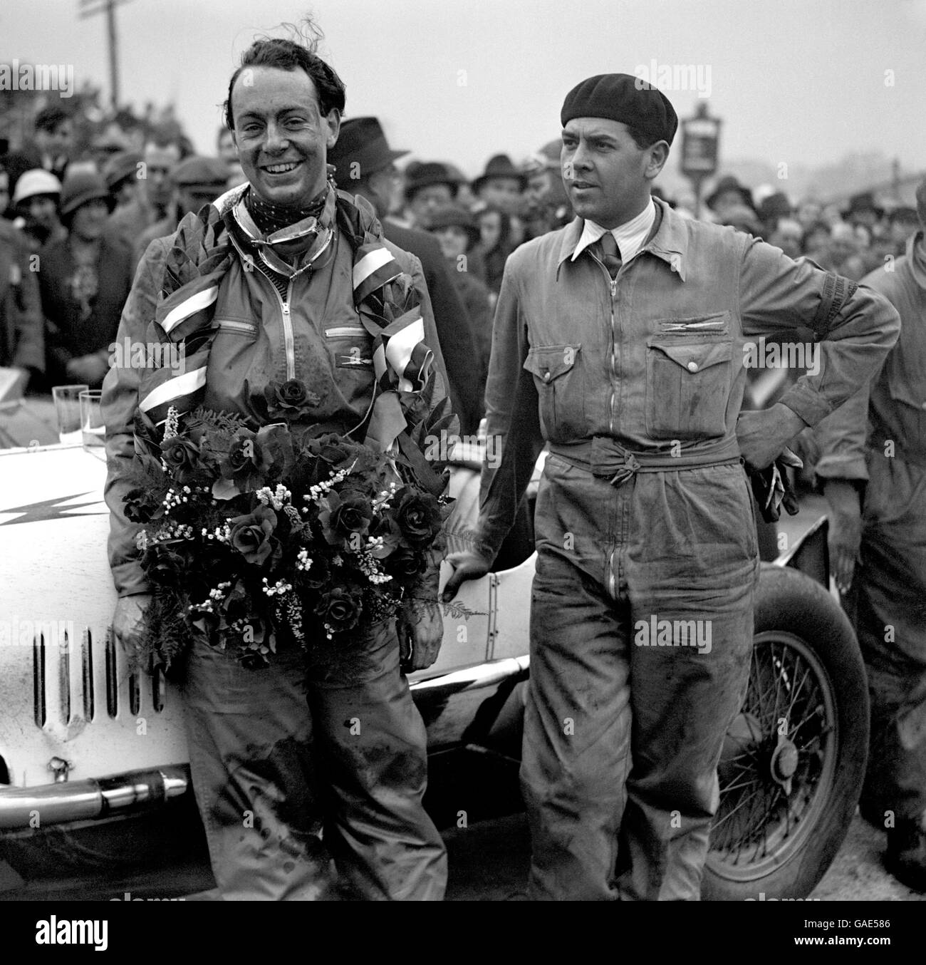 Motor Racing - JCC International Trophy Race - Brooklands. Race winner Whitney Straight with mechanic Guilio Ramponi after the race. Stock Photo