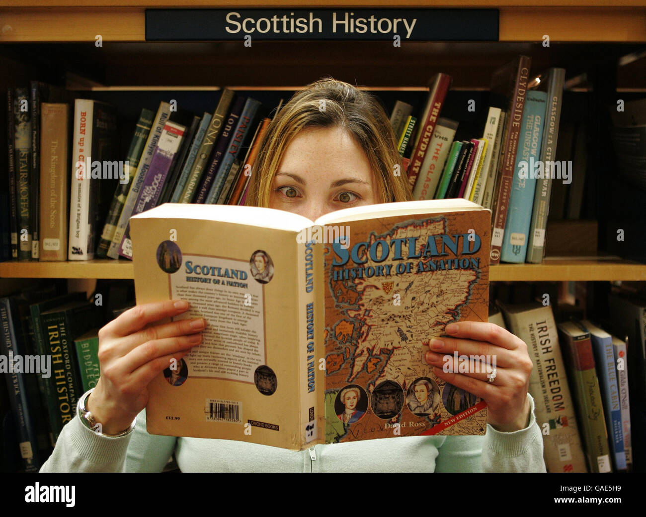 PICTURE POSED BY MODEL. A unnamed person reads a Scottish history book at Falkirk Library, after it was announced that Scottish history is to be a compulsory part of the Higher exam for the first time. Stock Photo