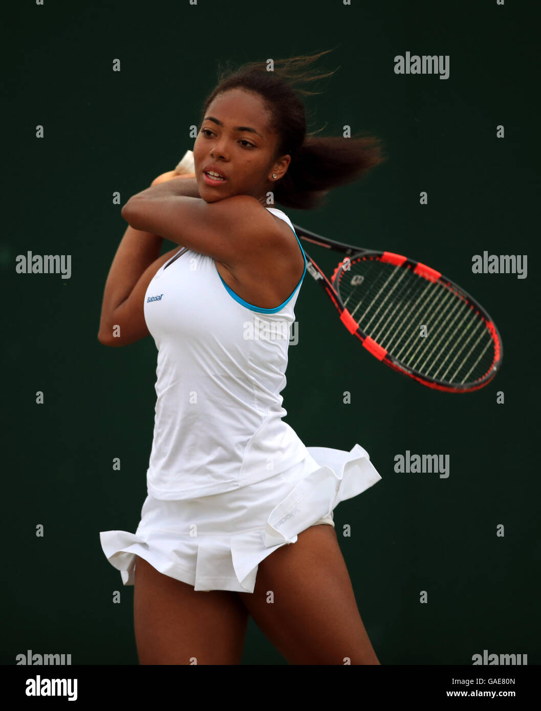 Lauryn John-Baptiste in action in the girls singles on day seven of the Wimbledon Championships at the All England Lawn Tennis and Croquet Club, Wimbledon. PRESS ASSOCIATION Photo. Picture date: Monday July 4, 2016. See PA story TENNIS Wimbledon. Photo credit should read: John Walton/PA Wire. RESTRICTIONS: Editorial use only. No commercial use without prior written consent of the AELTC. Still image use only - no moving images to emulate broadcast. No superimposing or removal of sponsor/ad logos. Call +44 (0)1158 447447 for further information. Stock Photo