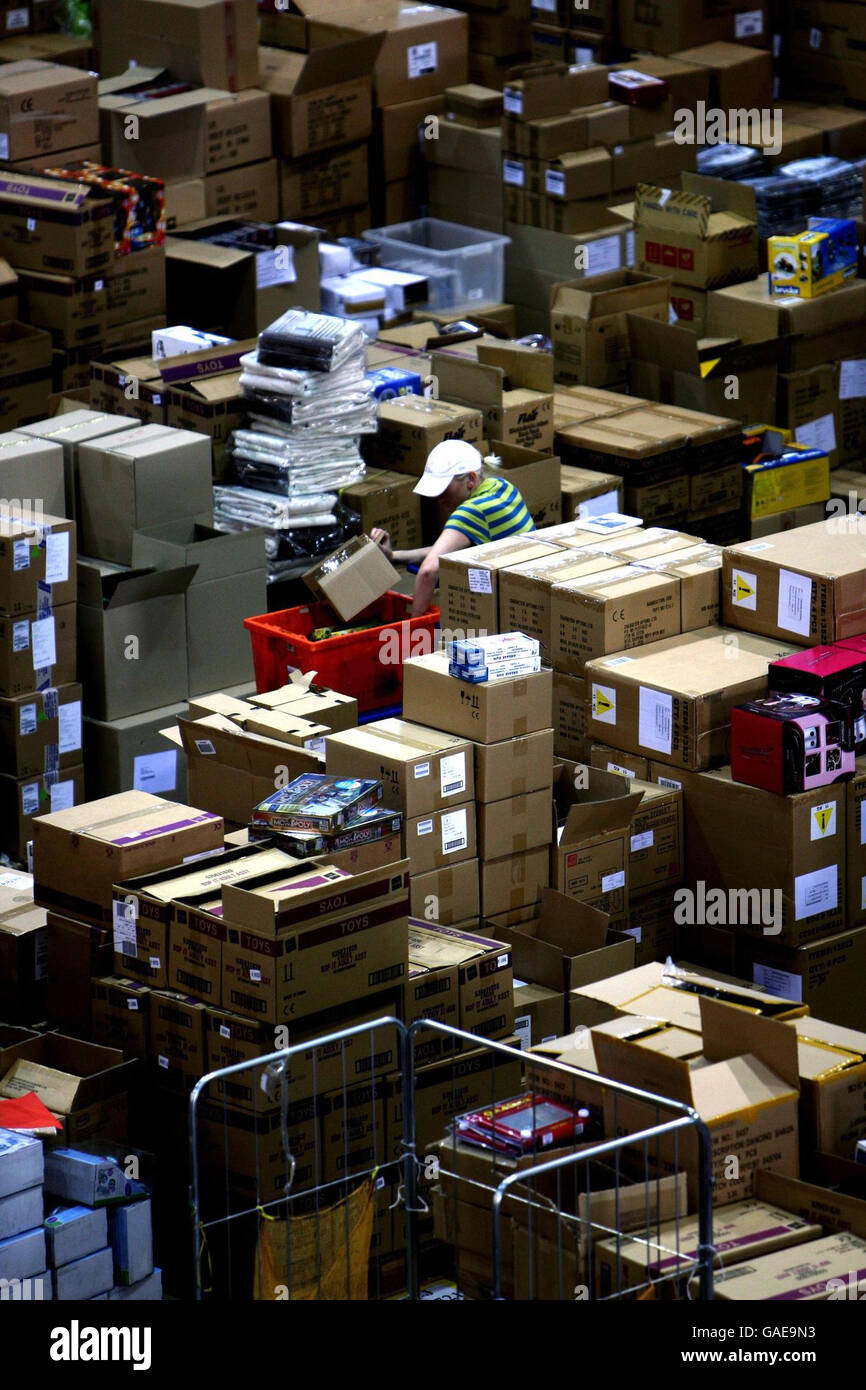 Parcels are prepared for dispatch at the Amazon.co.uk distribution centre near Milton Keynes. Stock Photo