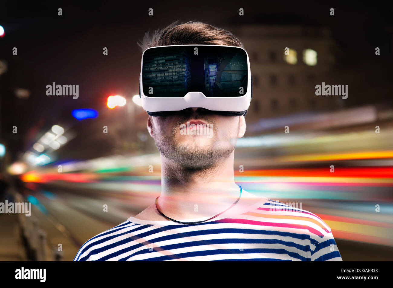 Double exposure, man wearing virtual reality goggles, night city Stock ...