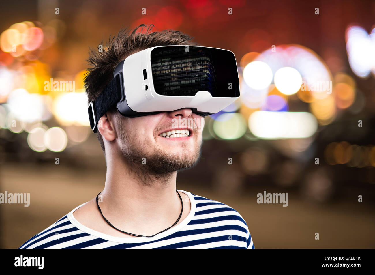 Double exposure, man wearing virtual reality goggles, night city Stock ...