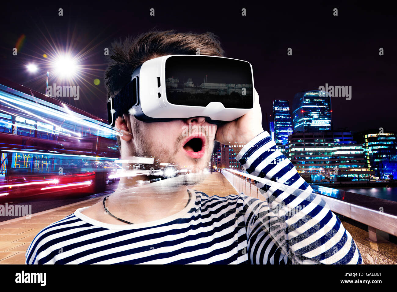 Double exposure, man wearing virtual reality goggles, night city Stock ...