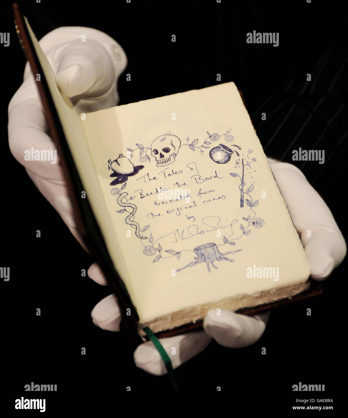A hand-written copy of 'The Tales of Beedle the Bard' by JK Rowling on show at Sotheby's in London today. The previously untold stories will be auctioned next week to raise money for 'The Children's Voice campaign. Stock Photo