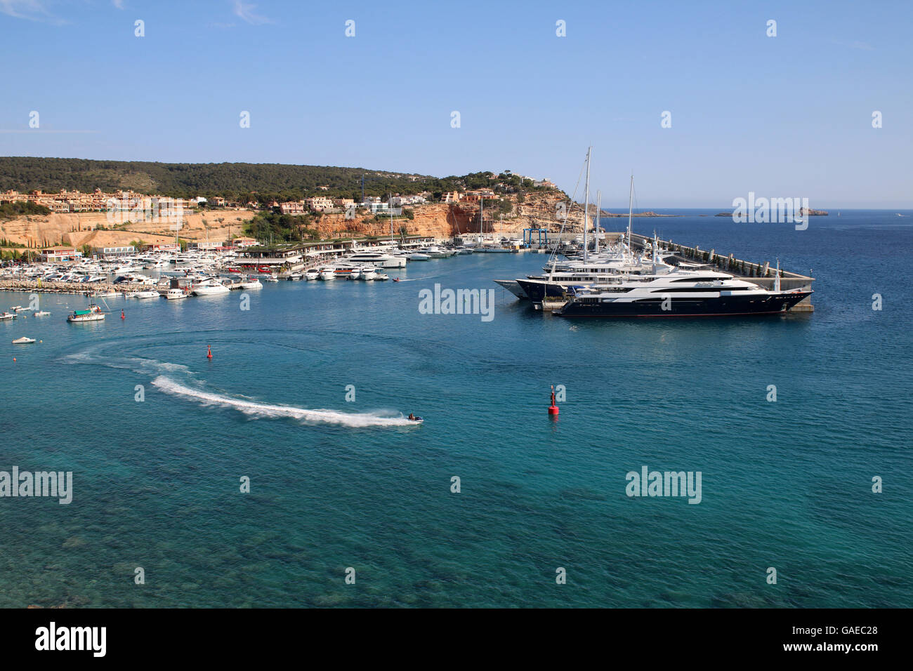 View over Port Adriano marina - Philippe Starck designed superyacht marina and commercial centre  with original marina on LHS Stock Photo