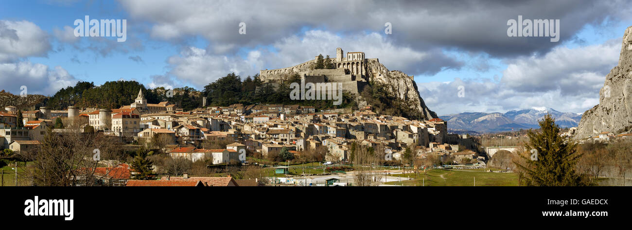 Sisteron, Citadel fortifications and rooftops with clouds. Southern Alps, France Stock Photo