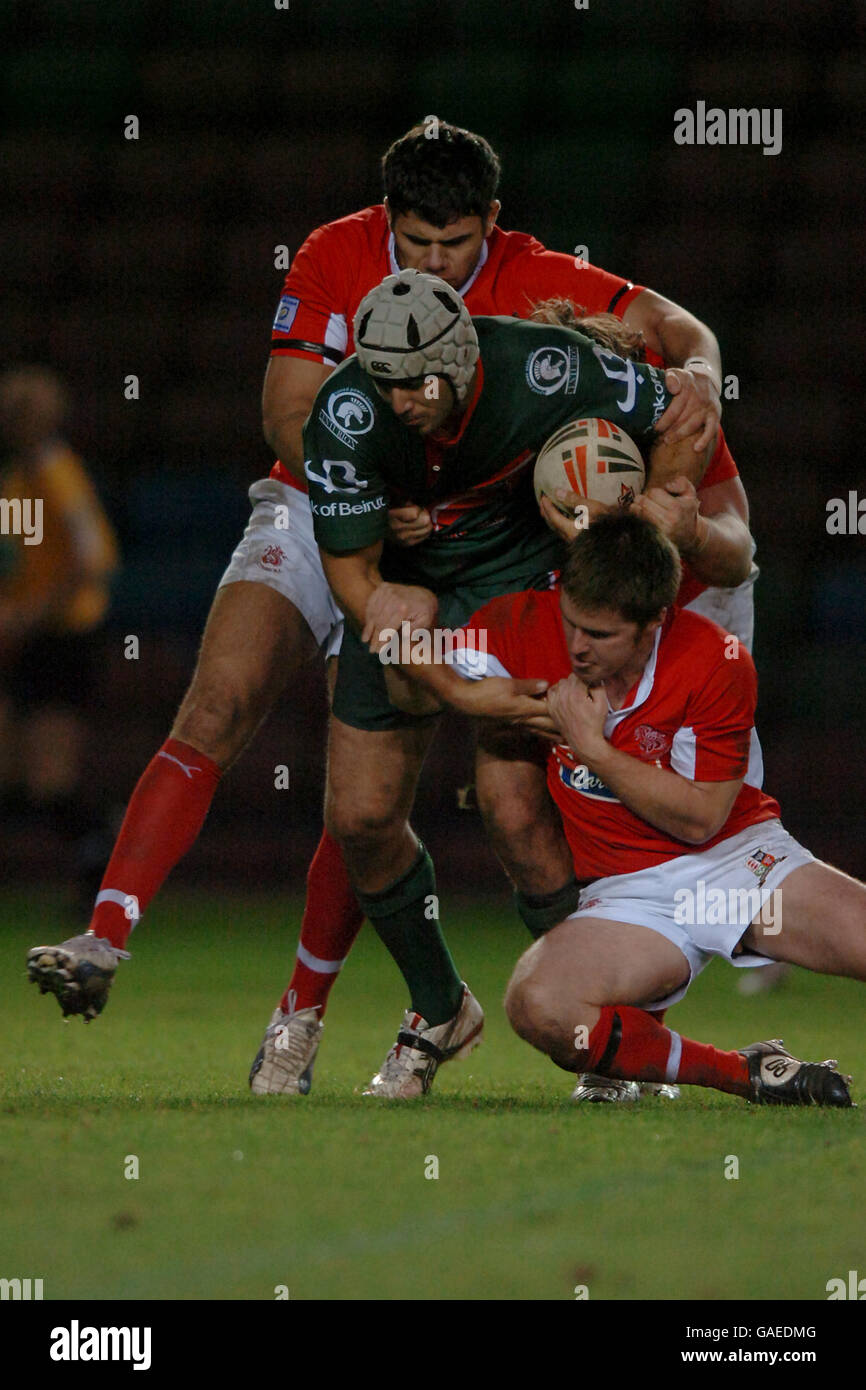 Lebanon's Khaled Deeb is challenged by Wales' Gareth Dean and Dave Halley Stock Photo