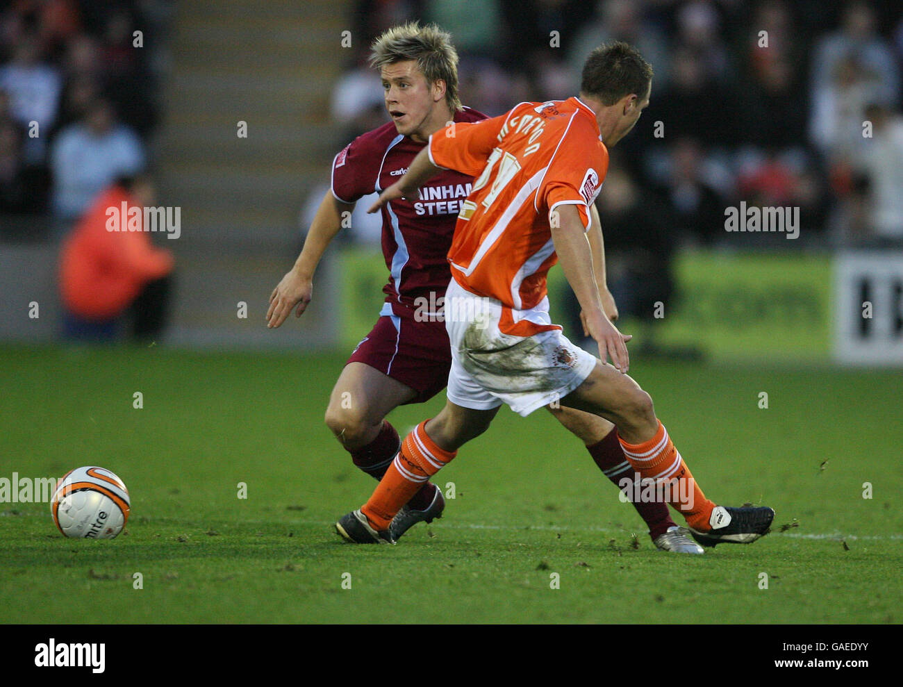 Blackpool's Tony McMahon and Scuntorpe United's Kevan Hurst during the Coca-Cola Football League Championship match at Bloomfield Road, Blackpool. Stock Photo