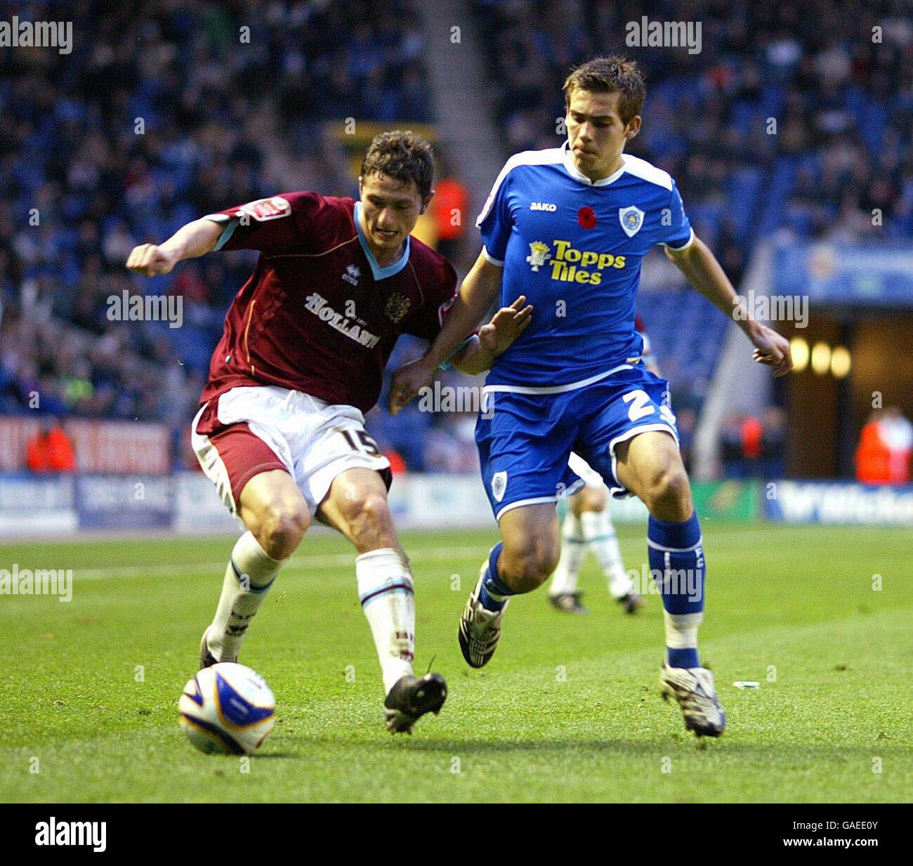 Soccer - Coca-Cola Football League Championship - Leicester City v Burnley - Walkers Stadium. Burnley John Spicer and Leicester's Joe Mattock during the Coca-Cola Football League Championship match at the Walkers Stadium, Leicester. Stock Photo