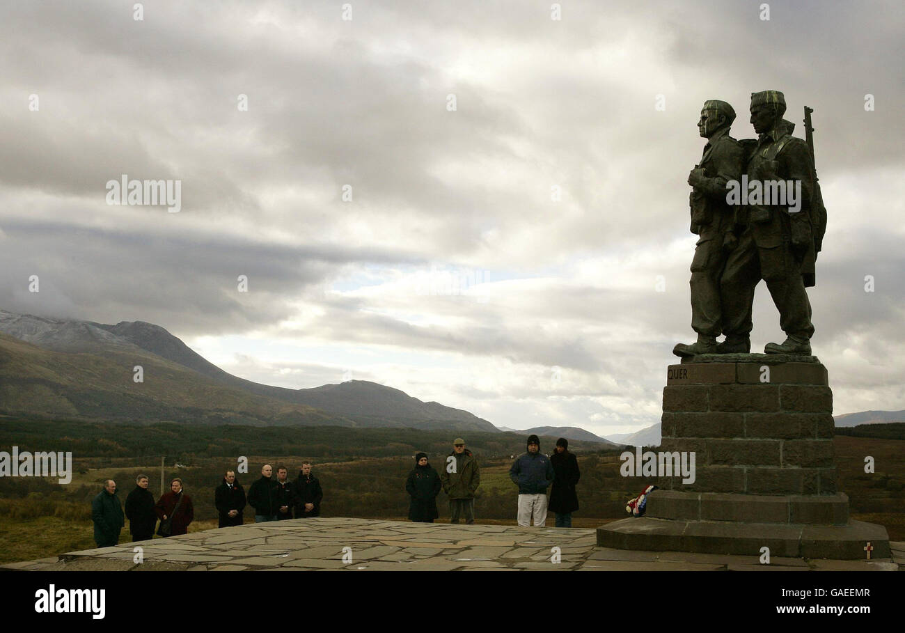 People pause at 11 o'clock to observe a 2 minutes silence at the Commando War Memorial at Spean Bridge on Remembrance Day. Stock Photo
