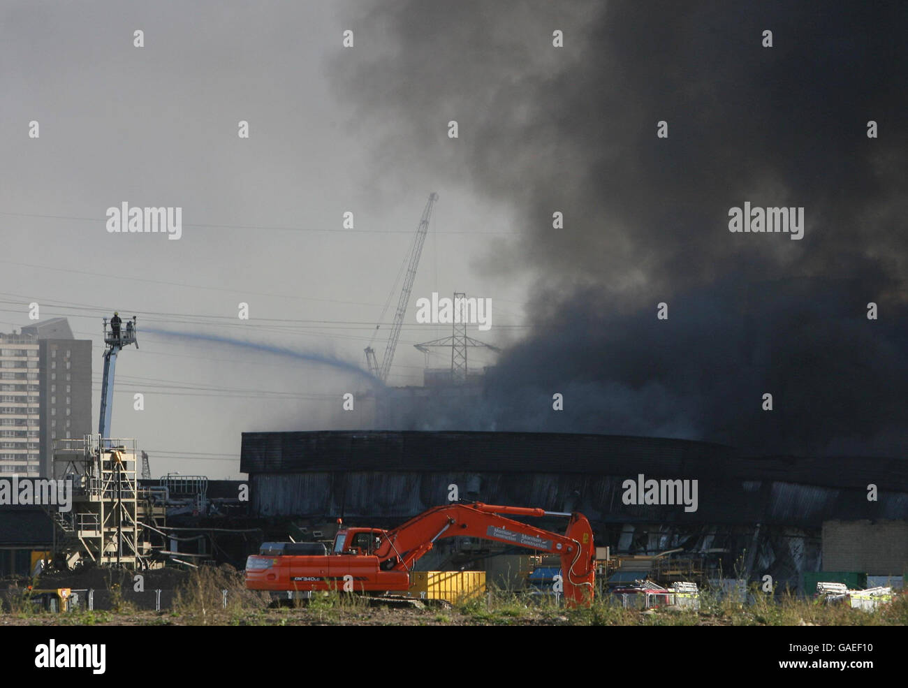 Fire in Stratford. Smoke bellows from a huge fire on the 2012 Olympic site in Stratford, east London. Stock Photo