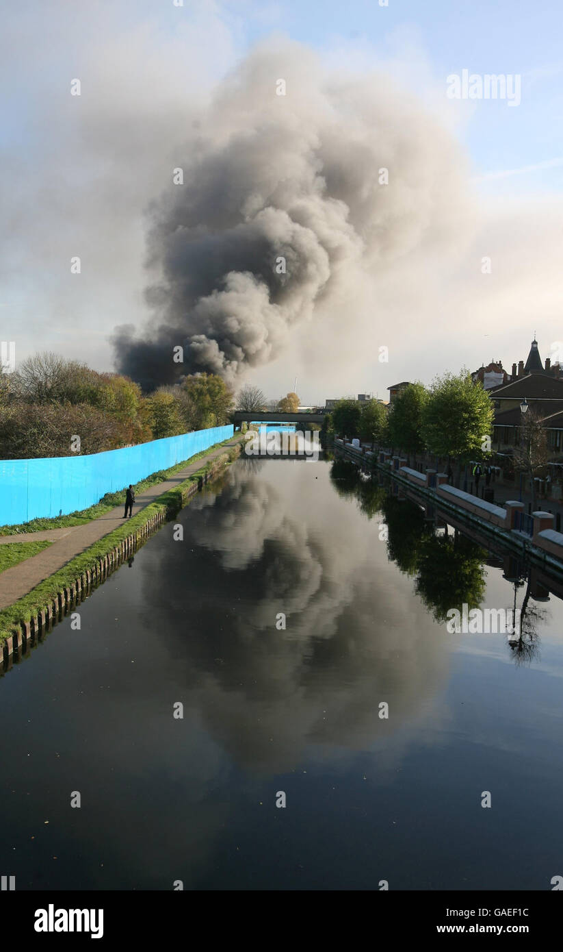 Smoke bellows from a huge fire on the 2012 Olympic site in Stratford, east London. Stock Photo