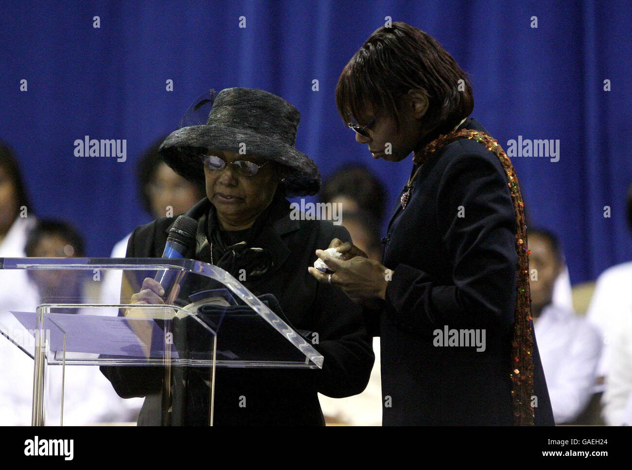Julien Warrington's mohter, Marcella (left) and sister Geraldine speak at his funeral at Ruach Ministries in Brixton, South London. Stock Photo