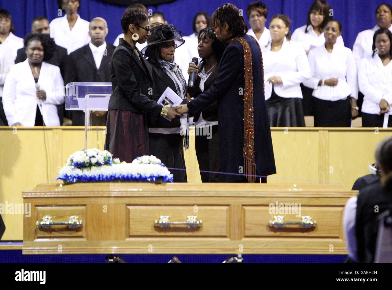 Julien Warrington's sisiters sing at his funeral, at Ruach Ministries in Brixton, South London. Stock Photo