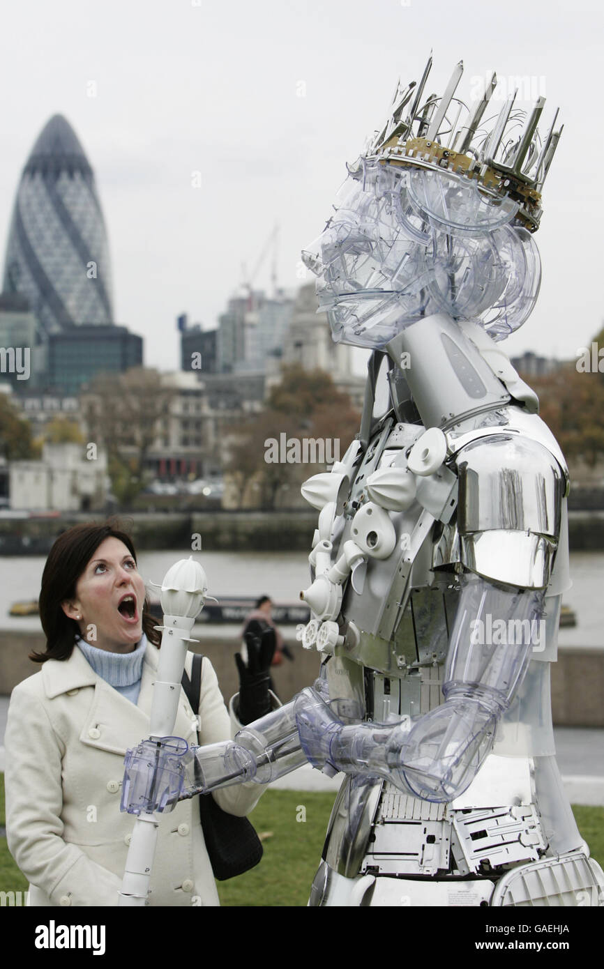 A passer by marvels at a statue, designed by sculptor Ptolemy Elrington, of Queen Elizabeth II made out of Kenwood products to be unveiled on the Southbank to mark her 60th wedding anniversary and to celebrate 60 years of innovation from Kenwood. PRESS ASSOCIATION Photo. Stock Photo