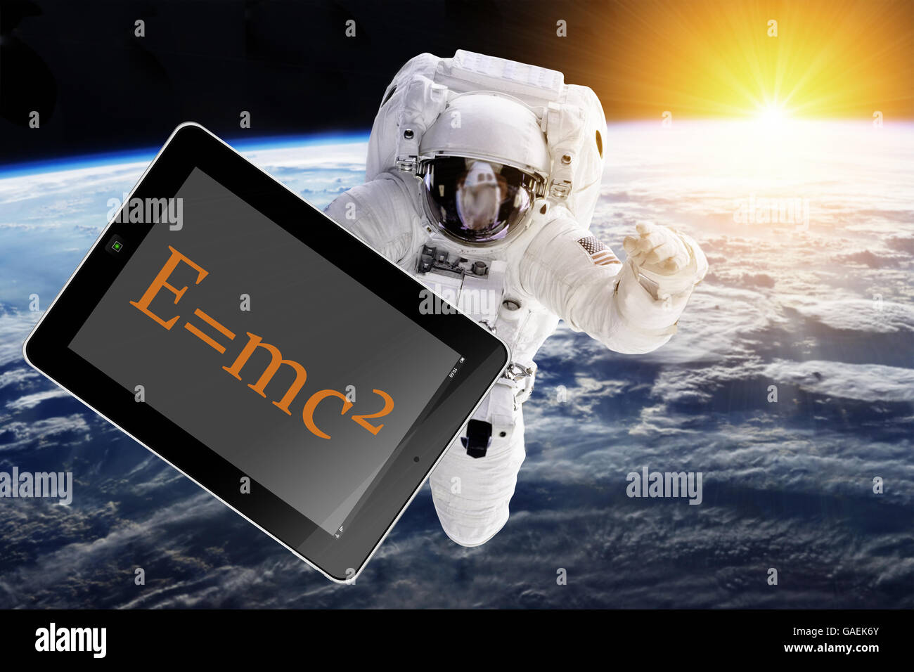 Astronaut with tablet in space - Elements of this image furnished by NASA Stock Photo