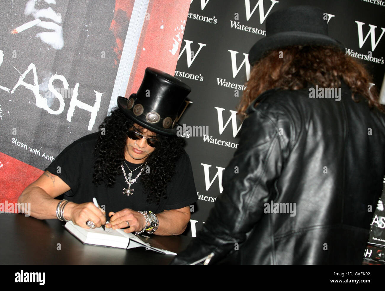 Former Guns N' Roses guitarist Slash signs copies of his autobiography ' Slash' at Waterstone's in Piccadilly, London Stock Photo - Alamy