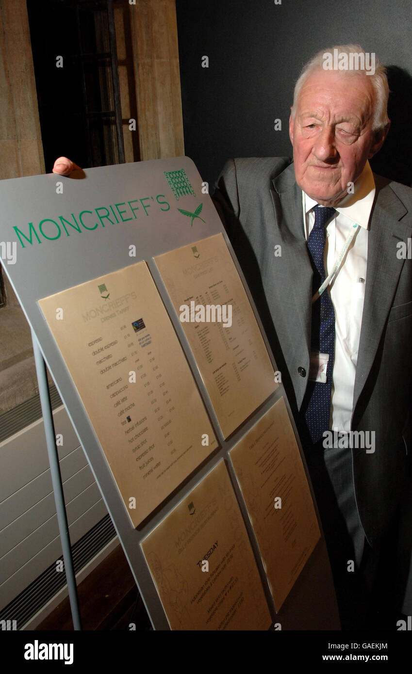 Press Association political correspondent Chris Moncrieff stands with the menu board at the official opening of Moncrieff's, a bar and restaurant in the press gallery of the Houses of Parliament, London, which has been named in his honour. Stock Photo