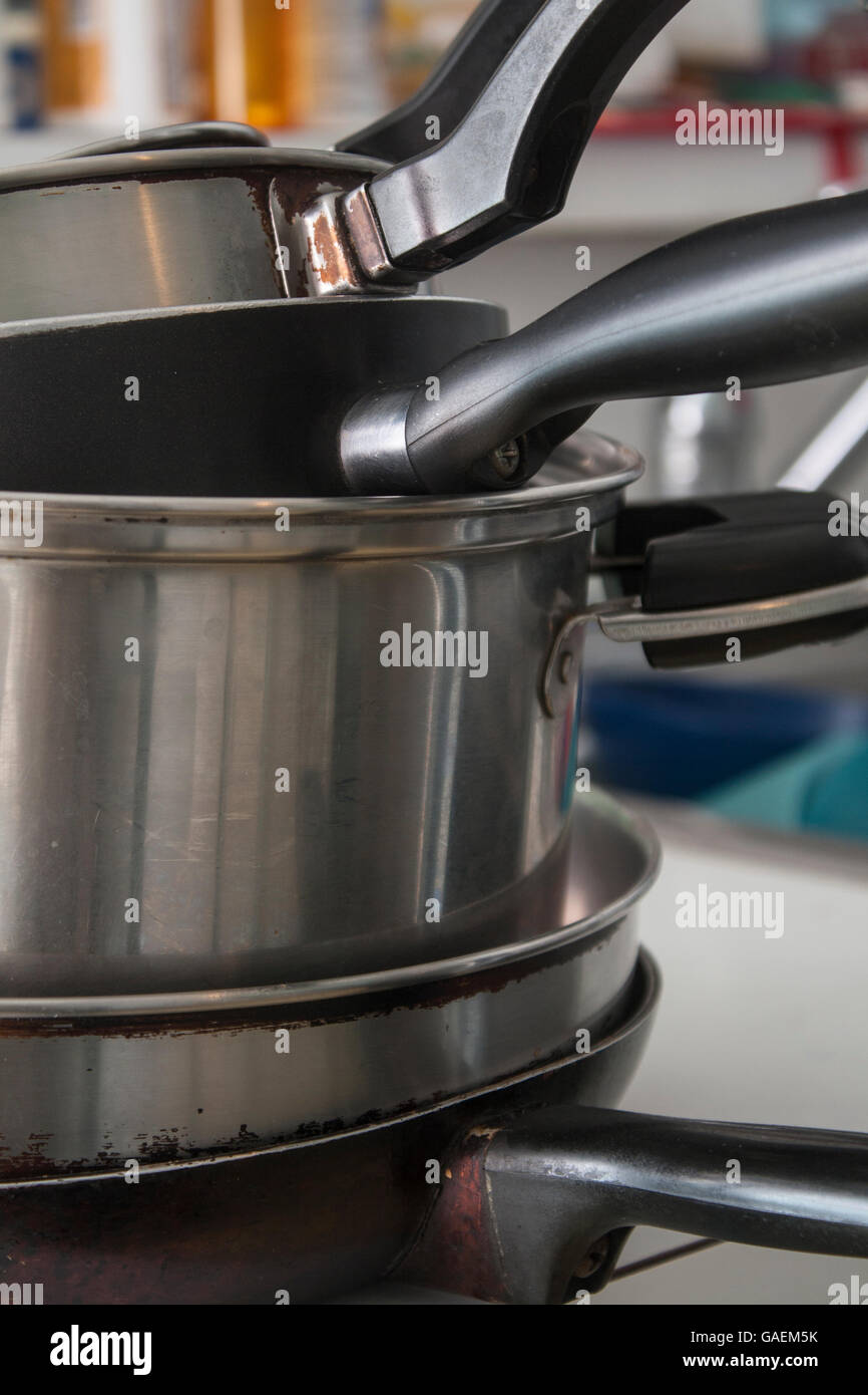 Stack of pots and pans in a kitchen Stock Photo Alamy