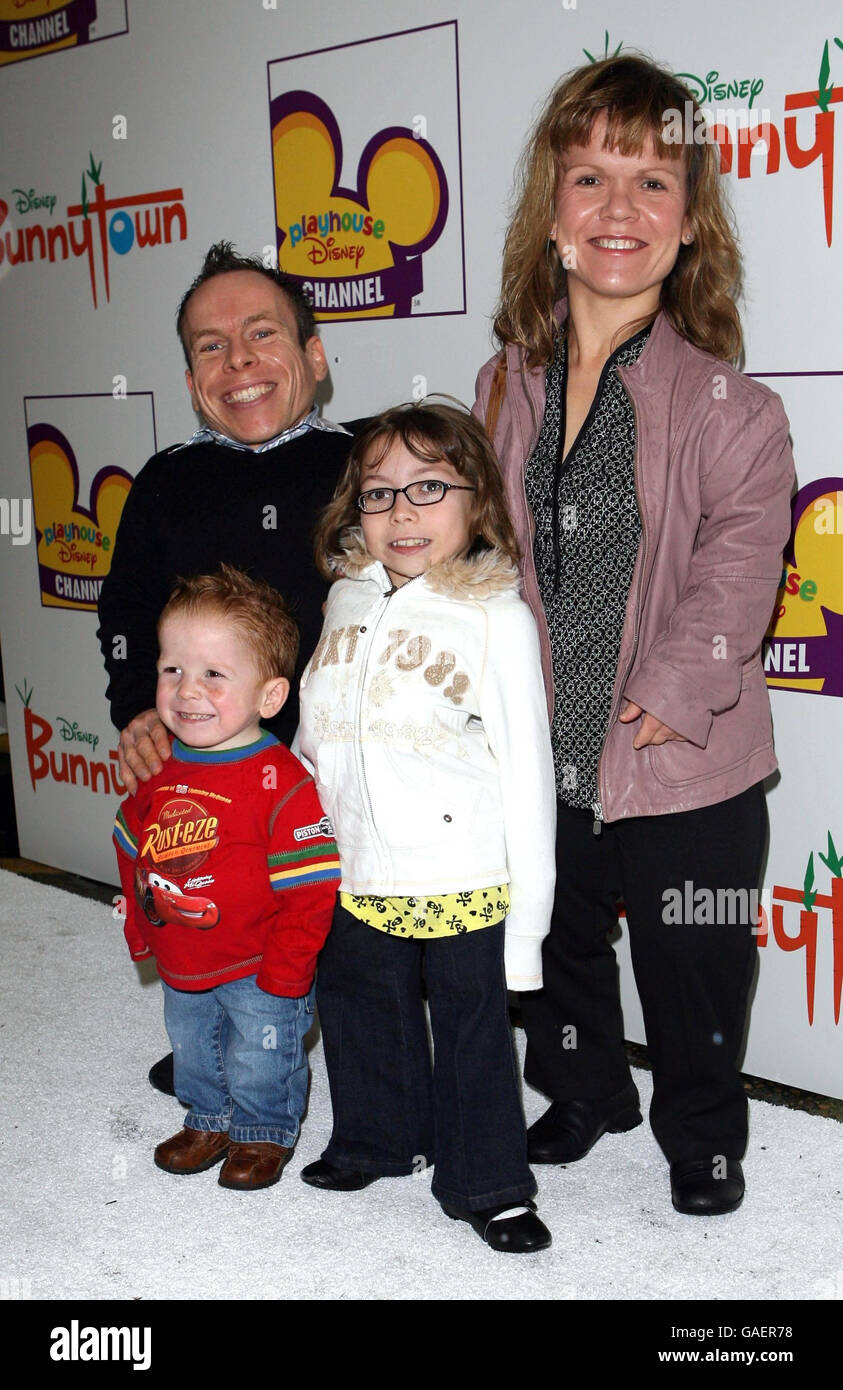 Warwick Davis and family arrive on the white carpet for