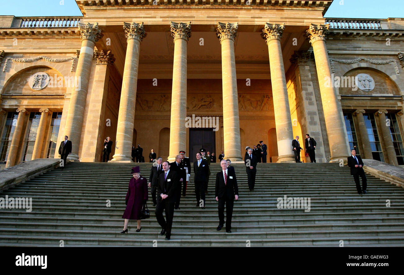 Britain's Queen Elizabeth II and the Duke of Edinburgh descend the South Portico steps at Stowe School during a visit in Stowe, Buckinghamshire. Stock Photo