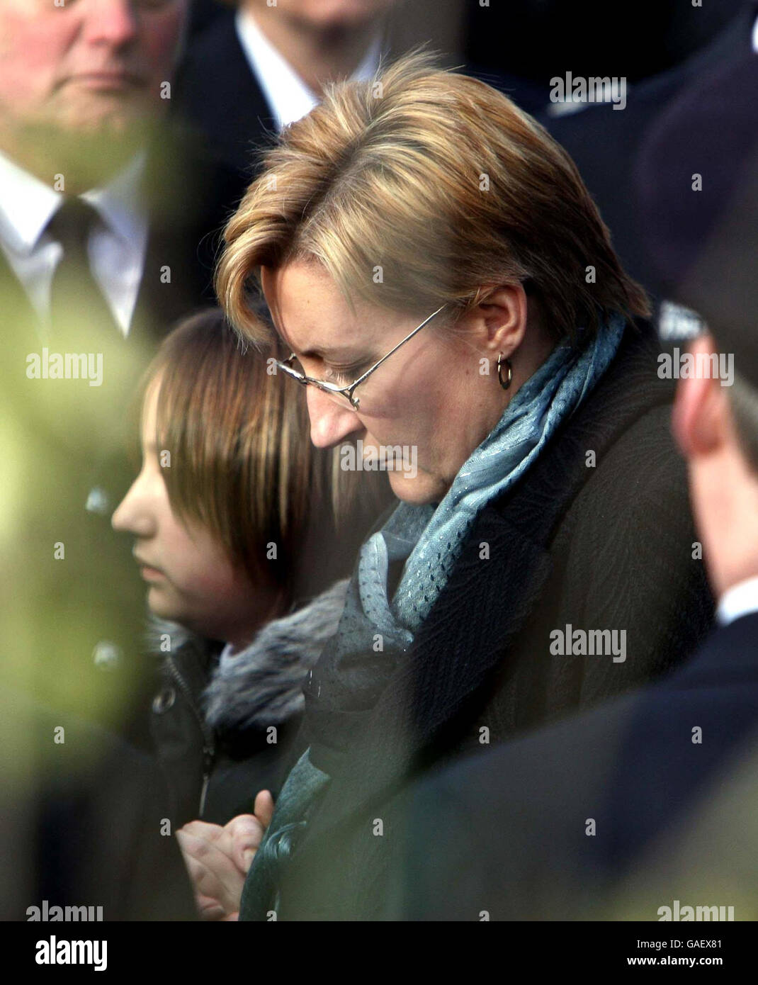 The family of Ian Reid, wife Julie and daughter Sophie, follow his coffin at St Gregory the