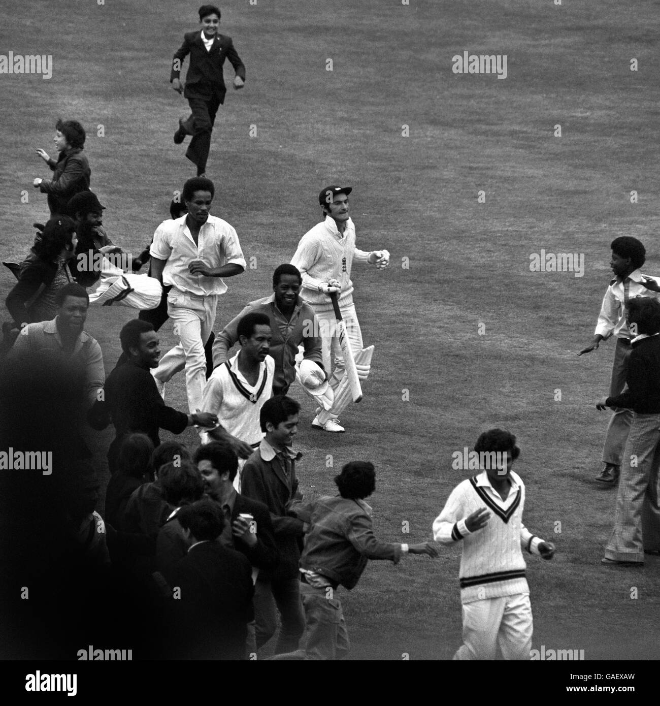 West Indian Keith Boyce, who took five first innings wickets for 70 runs, and Gary Sober(foreground) being congratulated by fans as they leave the field at the end of England's first innings on the third day of the first Test between England and the West Indies at the Oval. England were all out for 257, 158 runs behind the West Indies first innings total of 415. Stock Photo