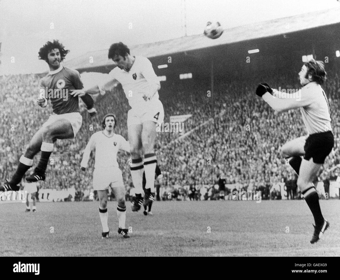 West Germany's Gerd Muller (l) heads the opening goal past Belgium goalkeeper Christian Piot (r) Stock Photo