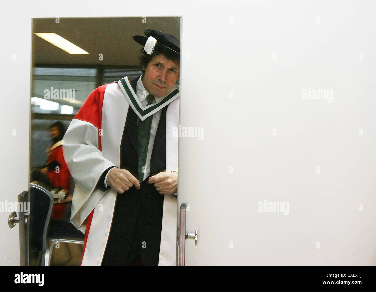 Actor Stephen Rea is dressed by Gowner Simon Norton, before he was awarded an Honorary Doctorate of Letters from UCD in recognition of his outstanding contribution to the performing arts, Dublin. Stock Photo
