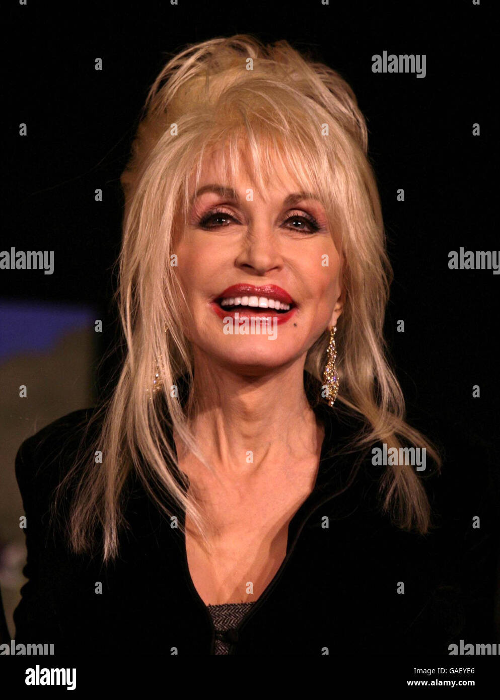 Dolly Parton performs at the launch of her Imagination Library of the United Kingdom - an educational initiative of her Dollywood Foundation that aims for every pre-school child to have their own library of books - at the Savoy Hotel in central London. Stock Photo