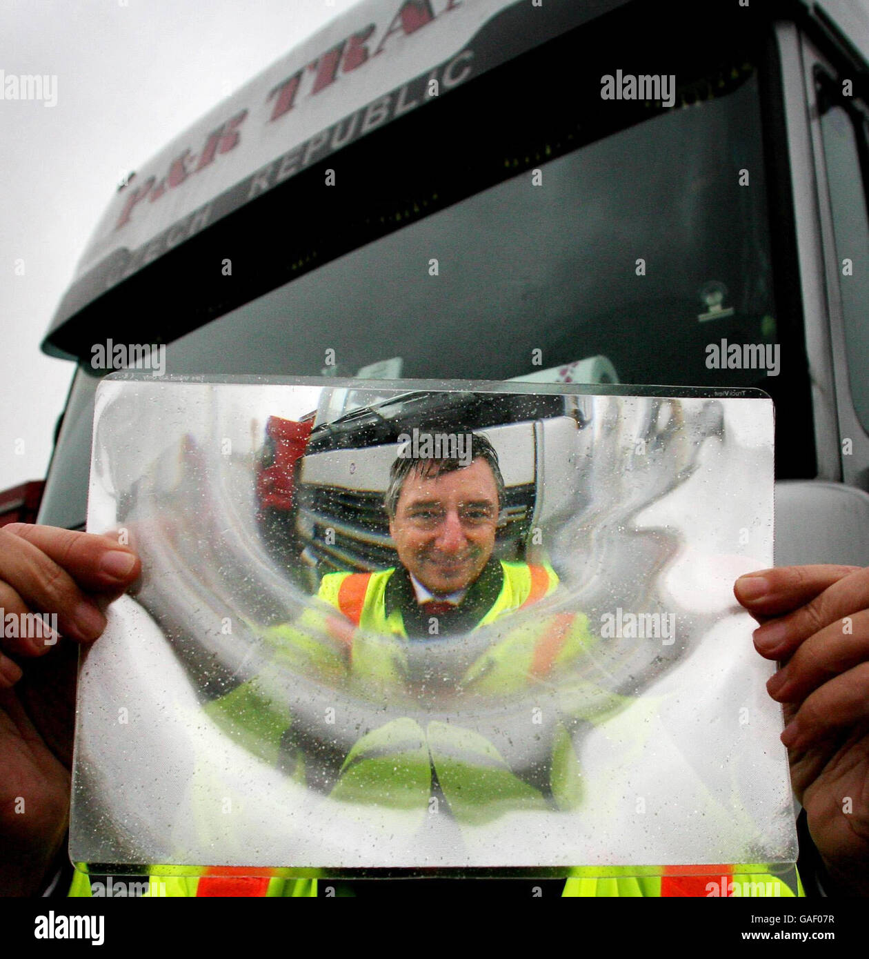 Road Safety Minister Jim Fitzpatrick holds a Fresnel Lens during a visit to the the Channel Tunnel Lorry Park in Ashford, Kent. Stock Photo