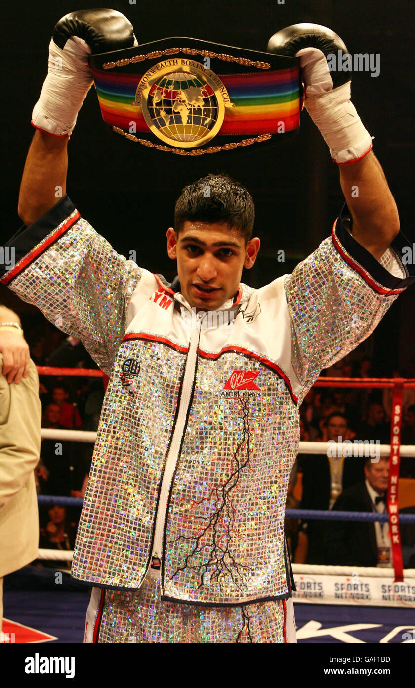 Amir Khan holds up the Commonwealth belt after his first round win over Graham Earl during the Commonwealth Lightweight Title fight at the Bolton Arena, Bolton. Stock Photo