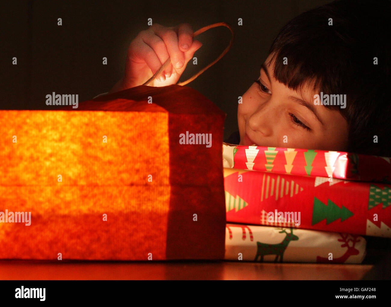 Picture posed by model. A young boy looks the Chrismas shopping as figures show that the number of shoppers are up as the holiday period gets closer. Stock Photo