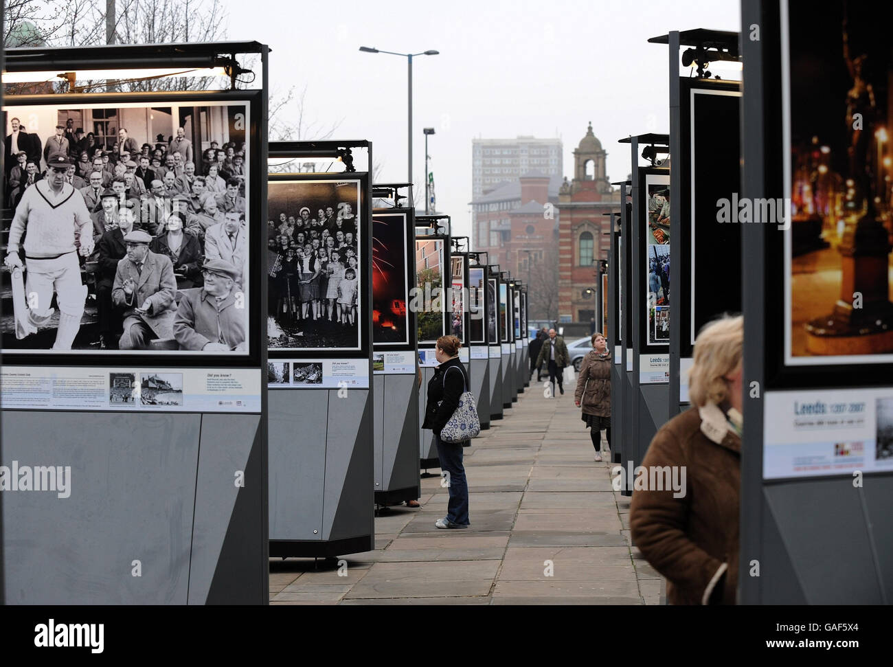 An outdoor photographic exhibition showing 800 years of life in the City of Leeds is proving a draw for Xmas shoppers as the gallery runs up one side of the Headrow, the main shopping street in Leeds. Stock Photo