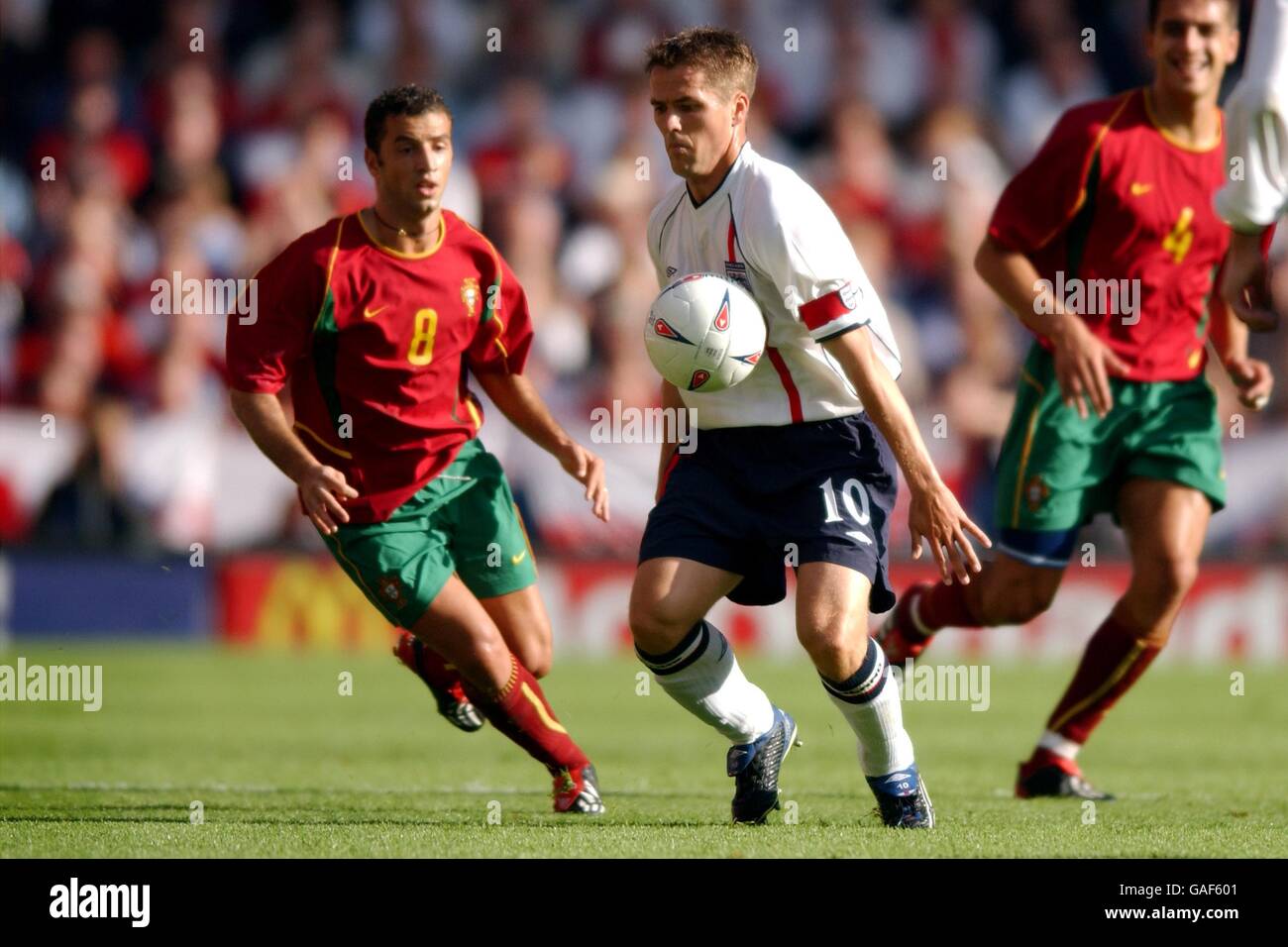 England's Michael Owen controls the ball in front of Portugal's Simao Sabrosa (l) Stock Photo