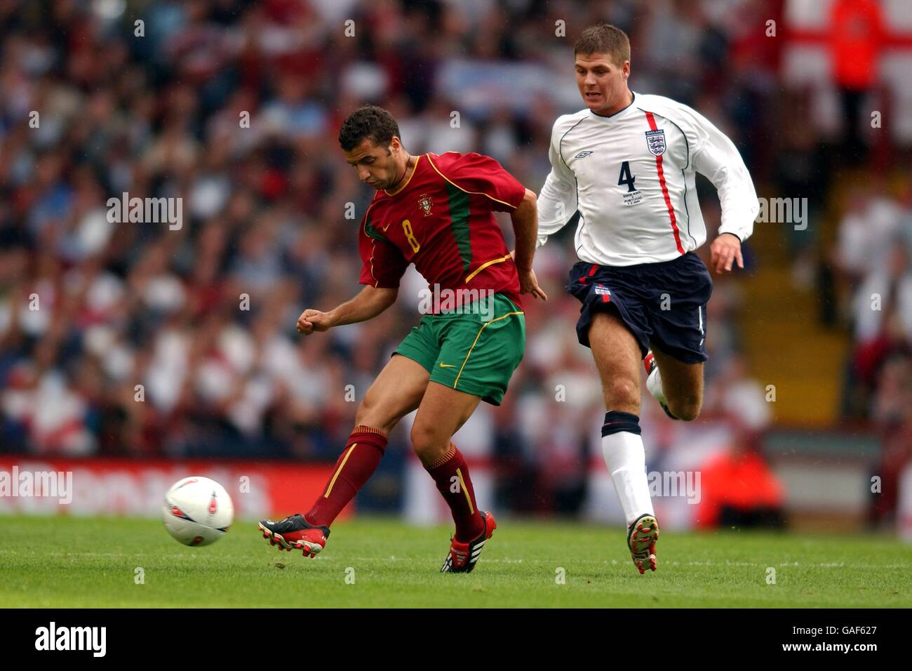 Soccer - International Friendly - England v Portugal. England's Steven Gerrard watches over Portugal's Simao Sabrosa Stock Photo