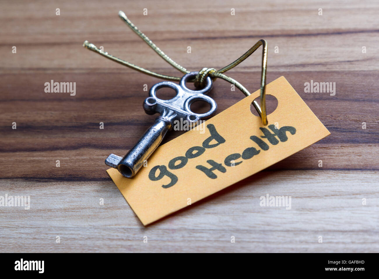 concept for a happy healthy life using an old decorative key and a hand ...