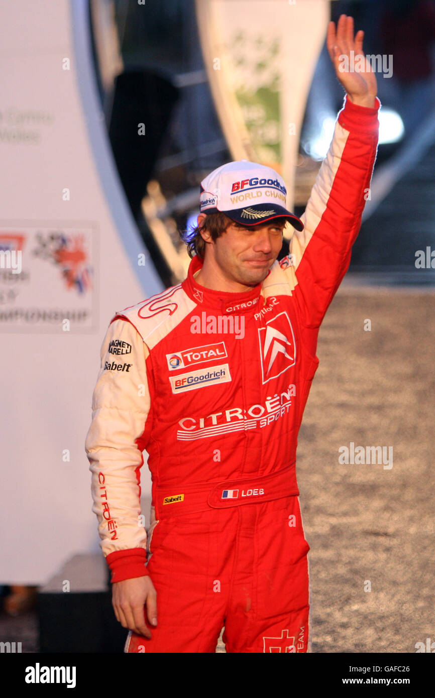 Sebastien Loeb of France acknowledges the crowd after finishing third